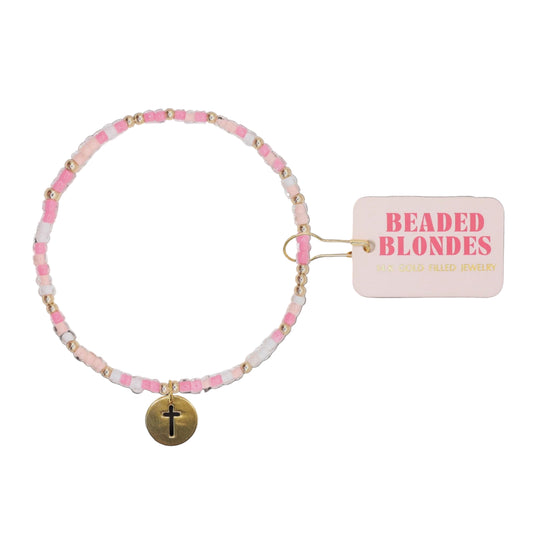 Beaded bracelet with pink beads and a gold charm on a white background, featuring 'Beaded Blondes' label.