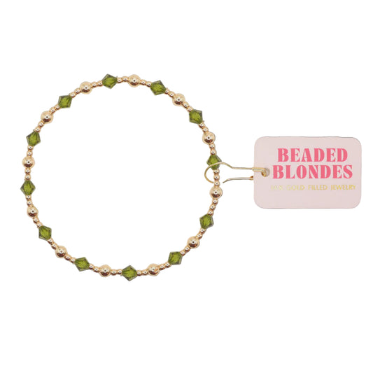Beaded bracelet with green and silver beads on a white background, featuring a 'Beaded Blondes' tag.