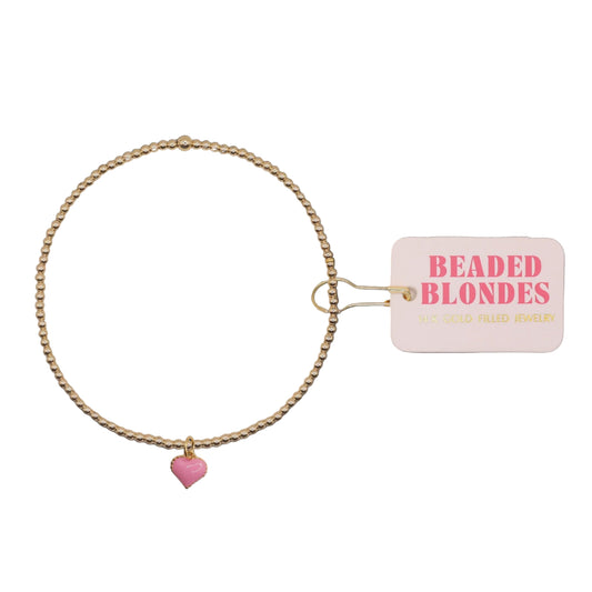 Gold beaded necklace with a pink heart charm and 'Beaded Blondes' tag on a white background
