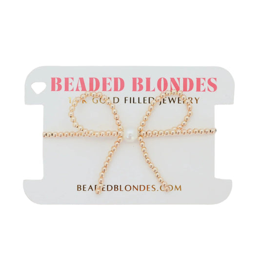 Gold beaded jewelry set on a 'Beaded Blondes' branded card