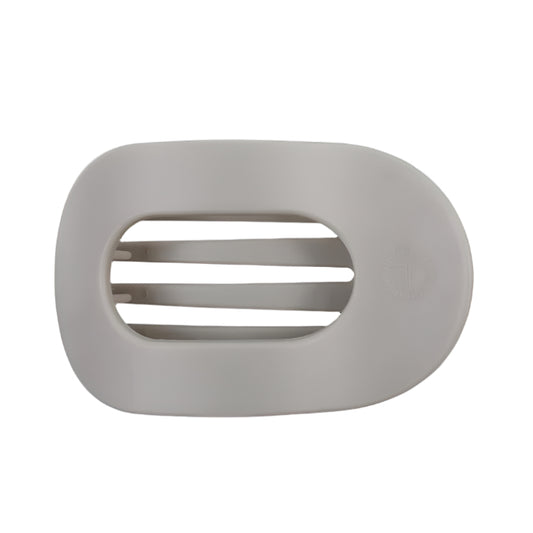 Gray hair clip with a brand logo on a white background