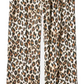 Leopard print pajama pants with a red drawstring on a white background