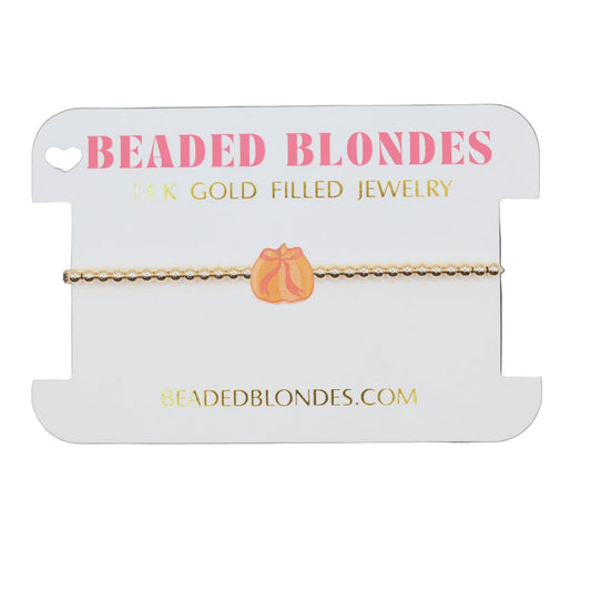 Beaded Blondes jewelry card with a bracelet on a white background