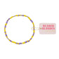 Beaded bracelet with yellow and purple beads , featuring a 'Beaded Blondes' tag.