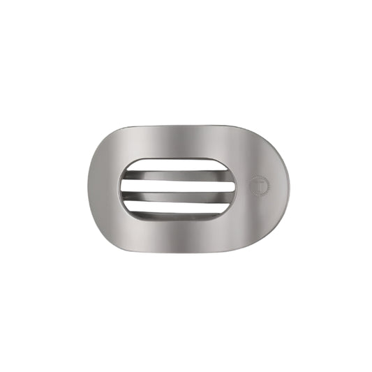 Metallic silver hair clip with a brand logo on a white background
