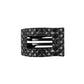 Black quilted hair clip with a brand logo on a white background
