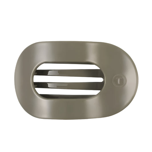 Sage hair clip with a brand logo on a white background
