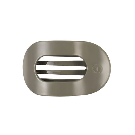 Sage hair clip with a brand logo on a white background
