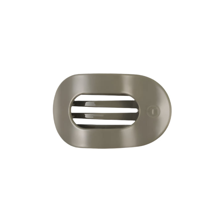 Sage hair clip with a brand logo on a white background
