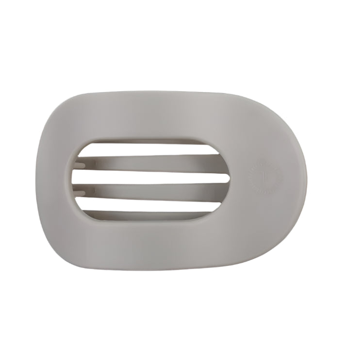 Gray hair clip with a brand logo on a white background
