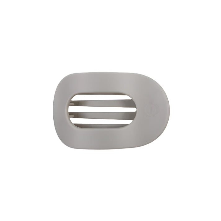 Gray hair clip with a brand logo on a white background
