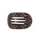 Brown quilted hair clip with a brand logo on a white background
